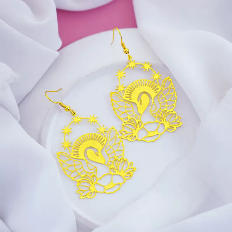 gold dangle earrings with stars, sunlight, wings and lotus flower design